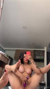 Legs up by the mirror using my vibrator to cum