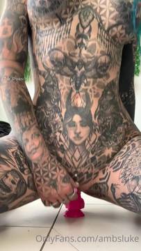 Full body tattooed and riding a dildo