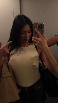 Big tits pushed up, middle finger raised