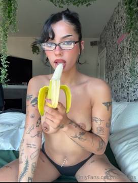 Sexy ass brunette eating banana in a slutty erotic way