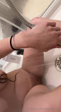 In the shower playing with the shower head feeling so hot