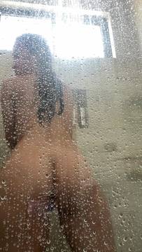 Ass cheeks spread wide under hot shower spray