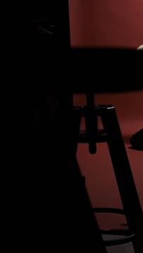 Bent over on the red floor, just kinda waiting for something to happen, not even sure what